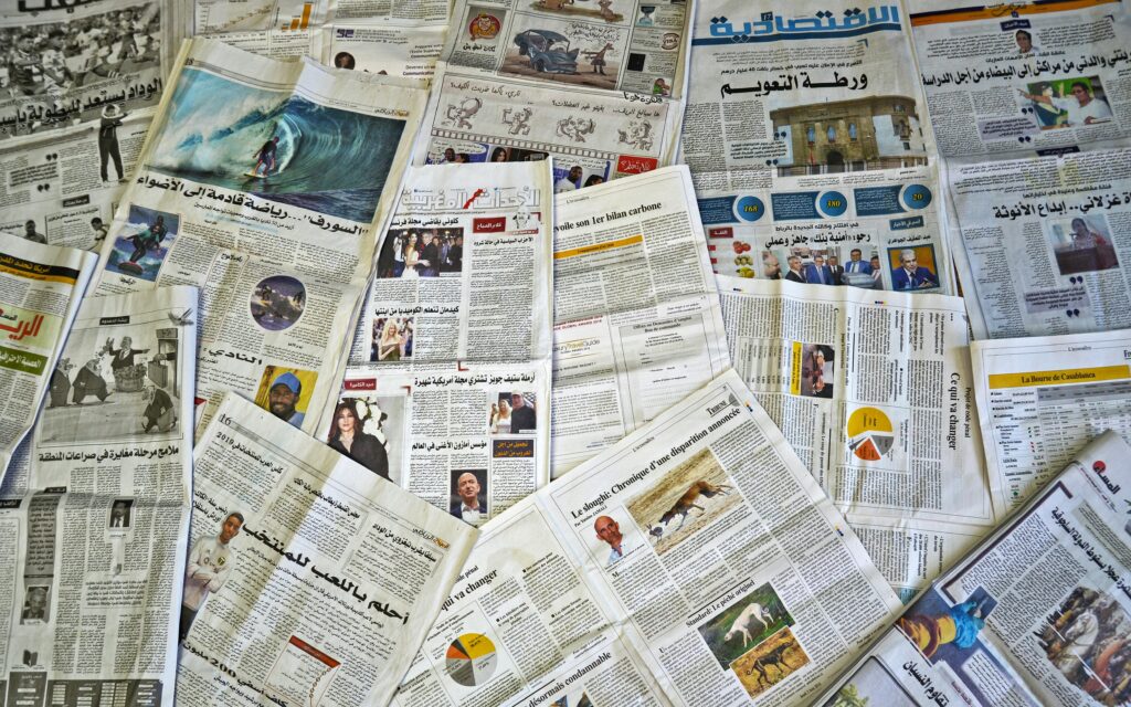Major corruption scandal exposed after documents leaked online A variety of Arabic newspapers laid out, showcasing cultural and news diversity in Fès, Morocco.