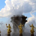 This is Test video 2 Stunning fountain with golden statues under a blue sky at VDNKh, showcasing artistic craftsmanship.